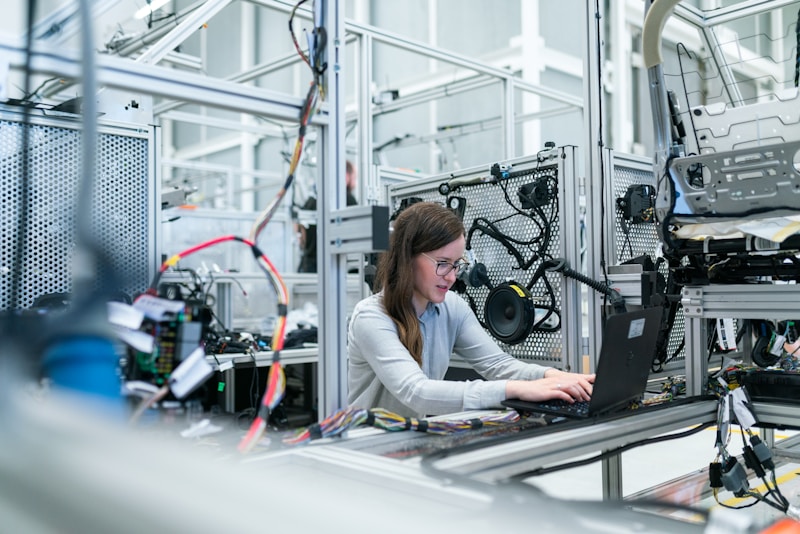 A focused engineer sitting at a computer screen taking a technical assessment on Crossover.