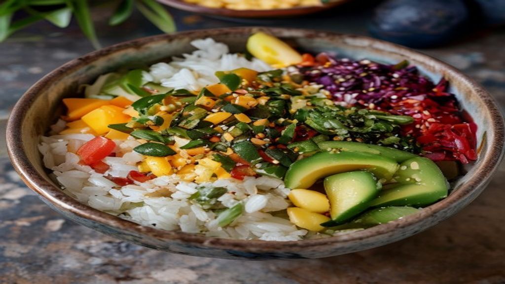 Vibrant Mexican-style rice bowl topped with pinto beans, corn, fresh tomatoes, and avocado salsa.